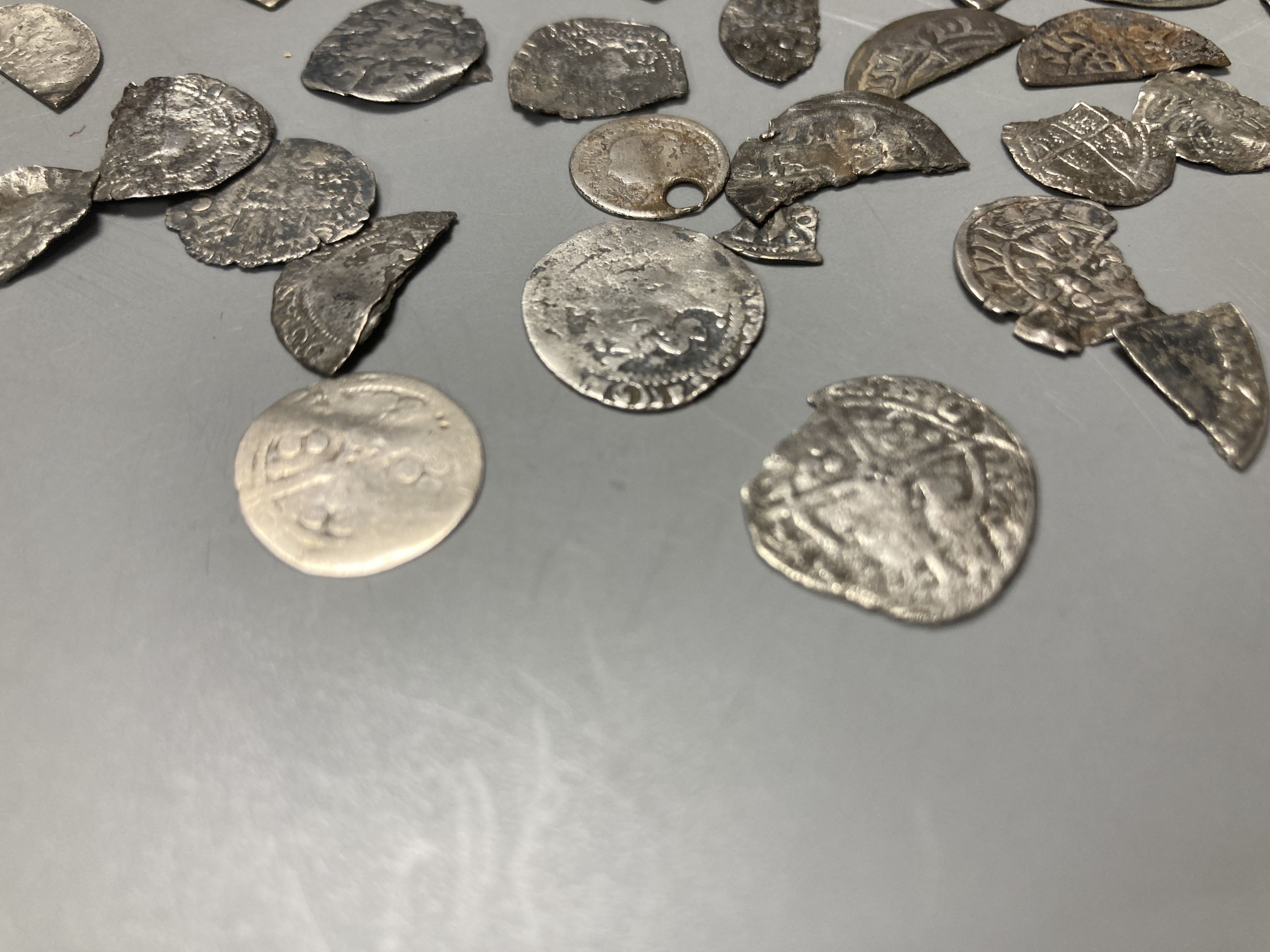 Medieval to Tudor hammered coinage - a collection of cut half and quarter short and long cross pennies and other fragments